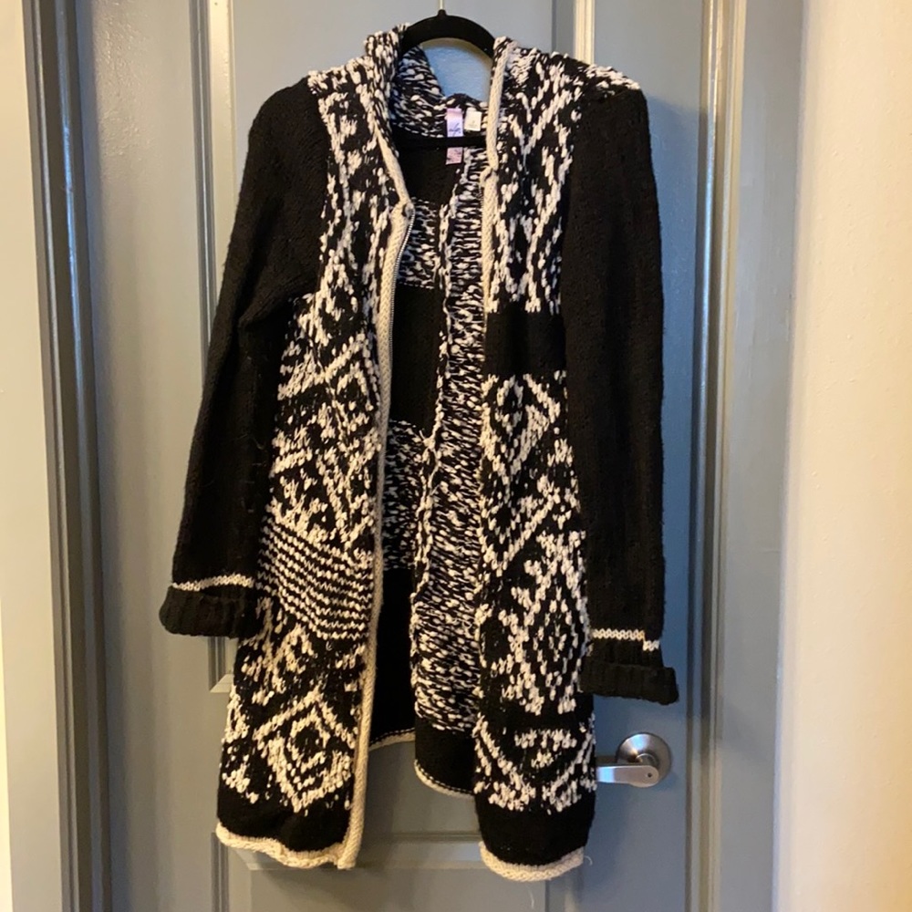 Long, woven Anthropologie sweater.